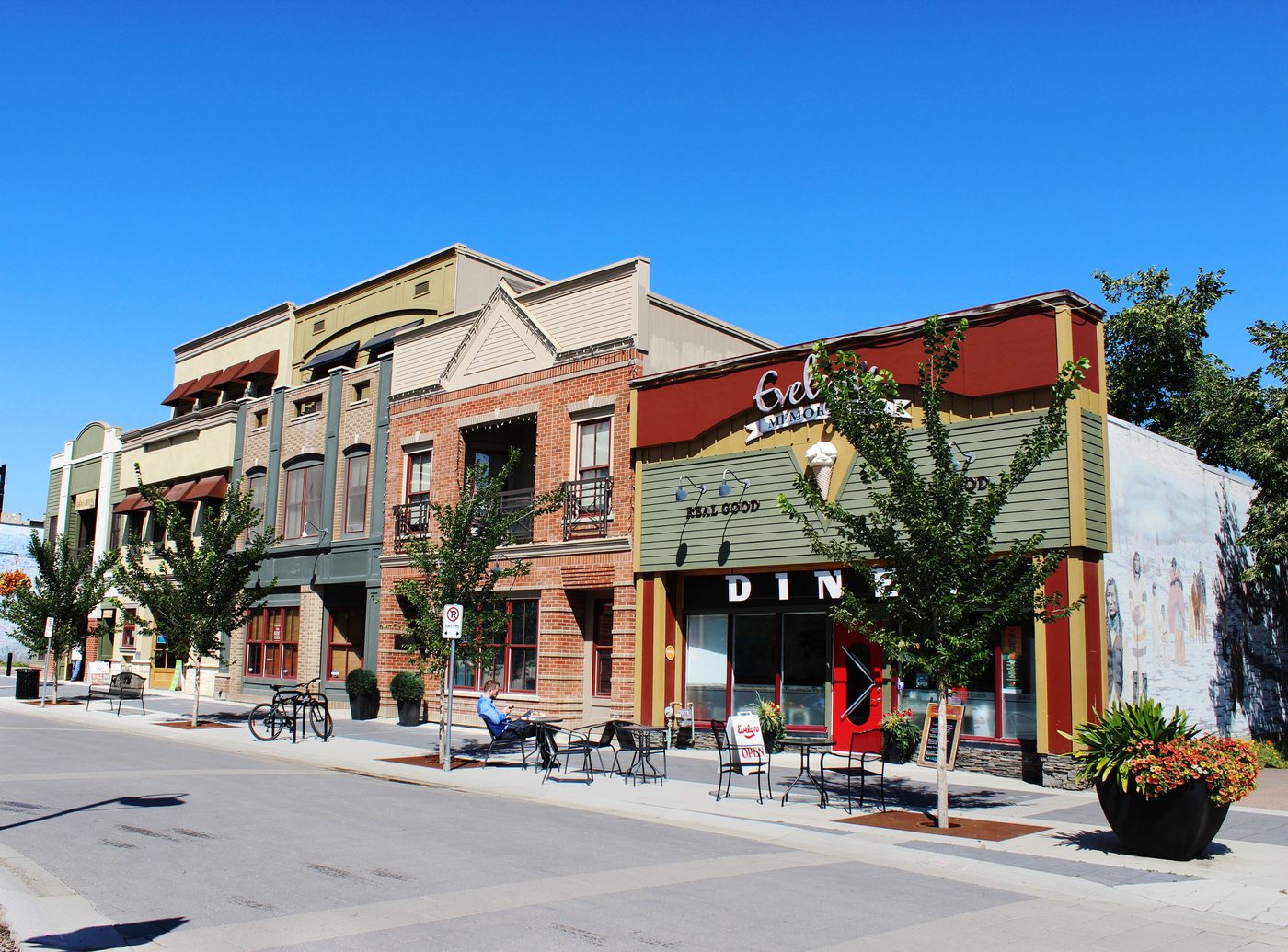 Main street storefronts with commercial lighting